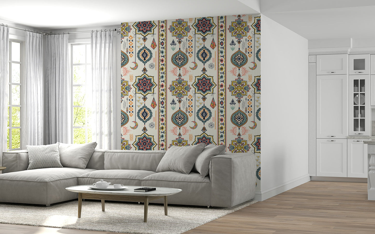 Boho Charms wallpaper in cream and pink on a living room wall with a grey sectional and marble coffee table