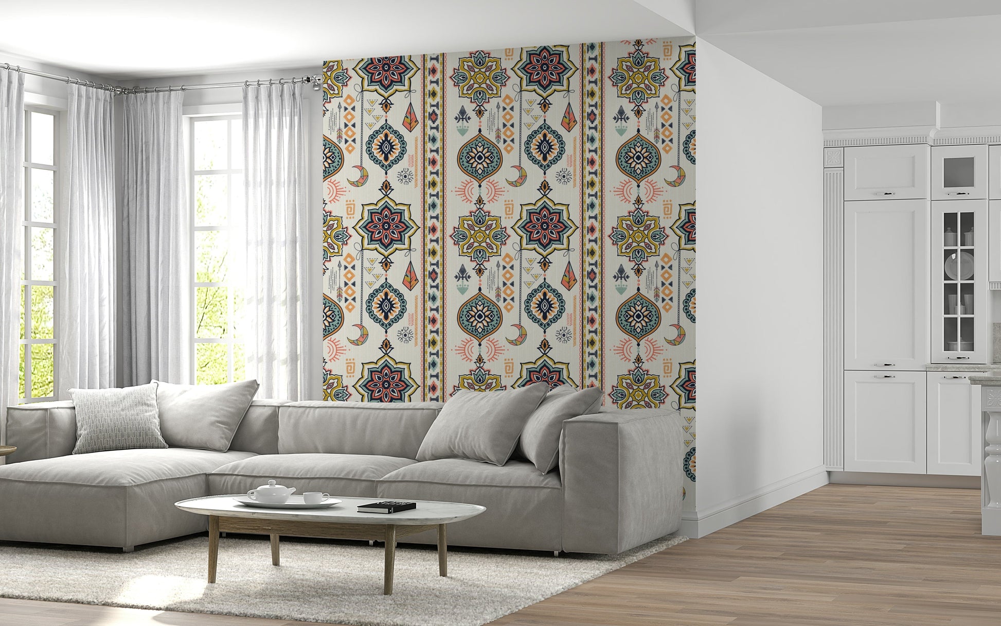 Boho Charms wallpaper in cream and pink on a living room wall with a grey sectional and marble coffee table