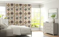 Boho Charms wallpaper in a bright bedroom with a white bed, grey dresser and sunny garden windows