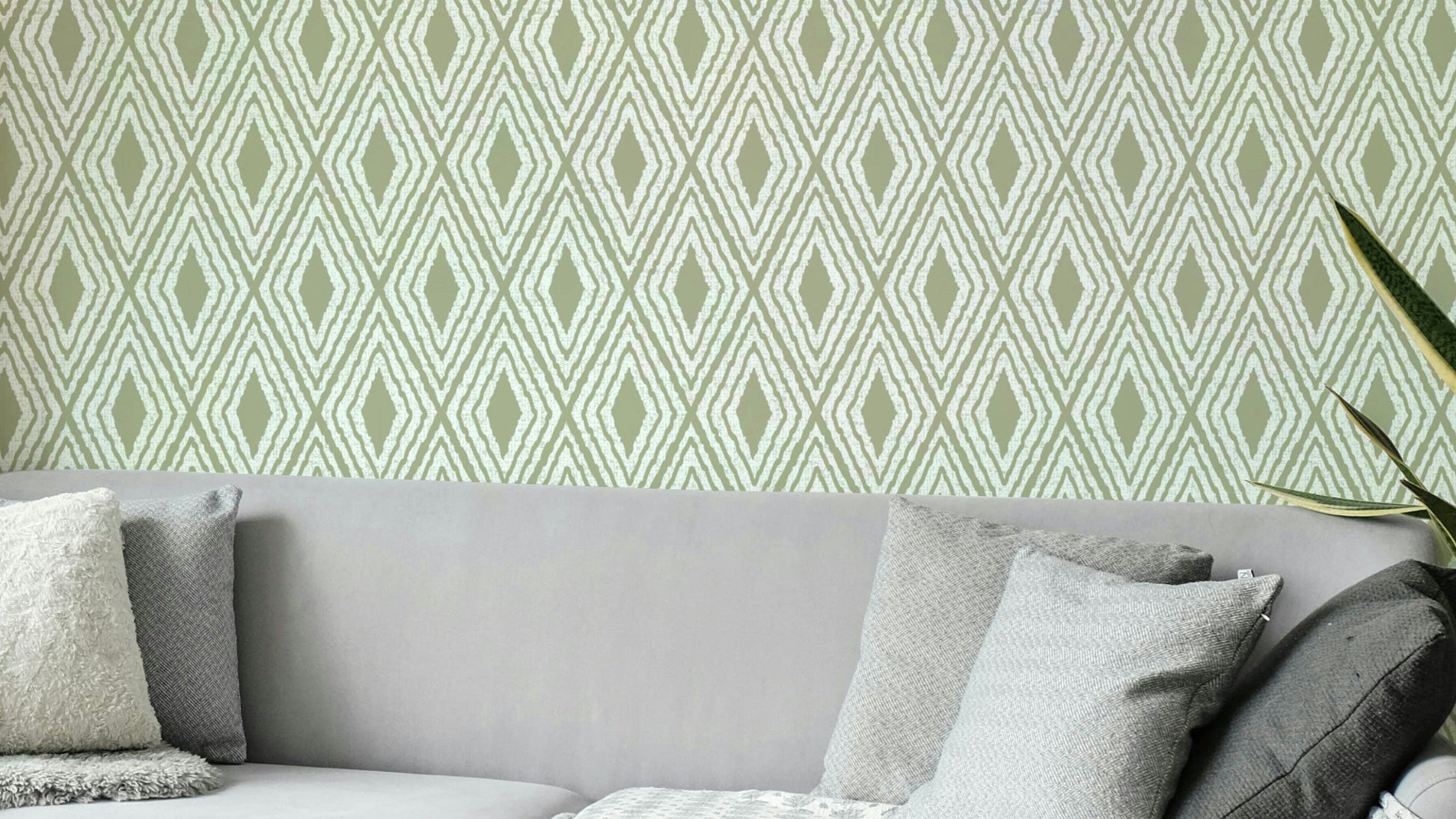 Muted green harlequin pattern wall design

