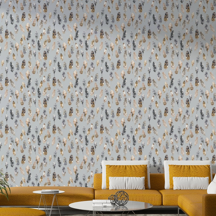 Golden and silver foil feathers on wallpaper

