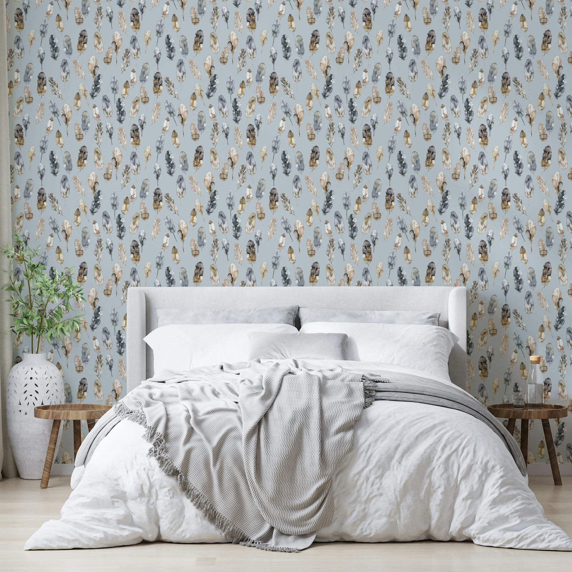 Silver and gold feather pattern on soft backdrop

