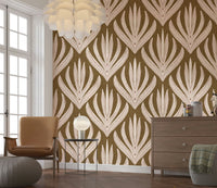 Earthy boho wallpaper mural with cream and rust-toned leaf motifs on a textured brown backdrop.