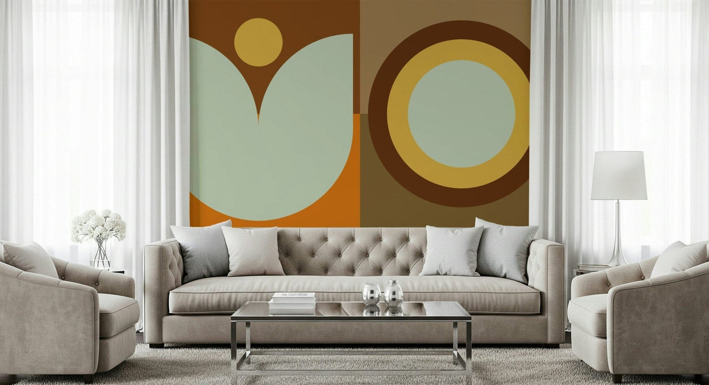 Boho Sun and Moon wallpaper mural with rust circles and sage shapes behind a tufted beige sofa in a curtained living room