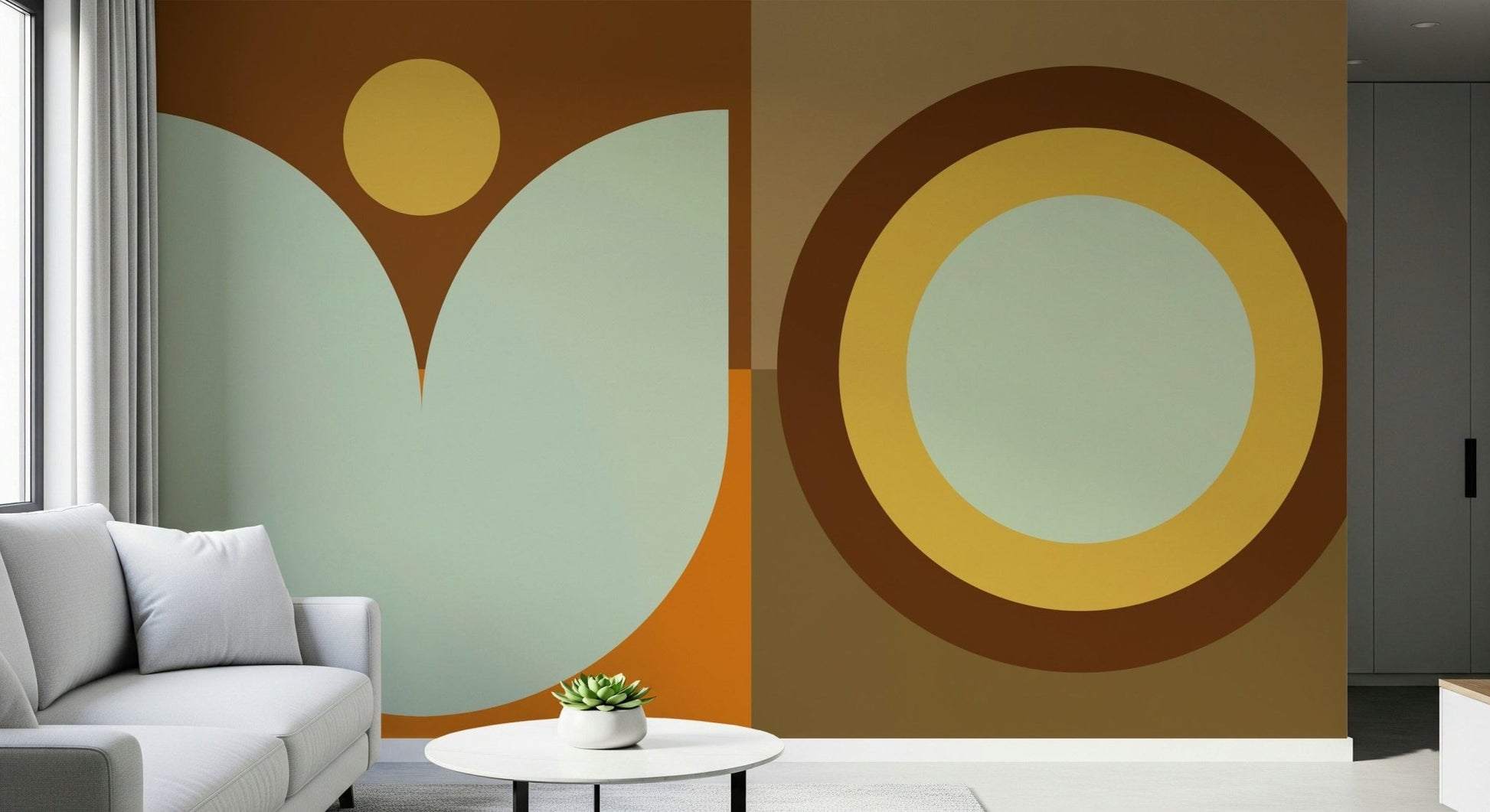 Boho Sun and Moon wallpaper mural in brown, yellow and sage behind a white sofa and round table in a living room