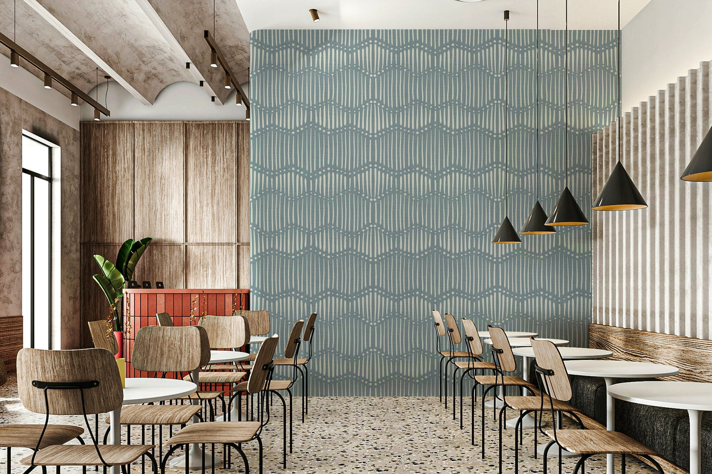 Boho Waves On Arona Canvas wallpaper as a dusty blue feature wall in a cafe with wood chairs and black cone pendants
