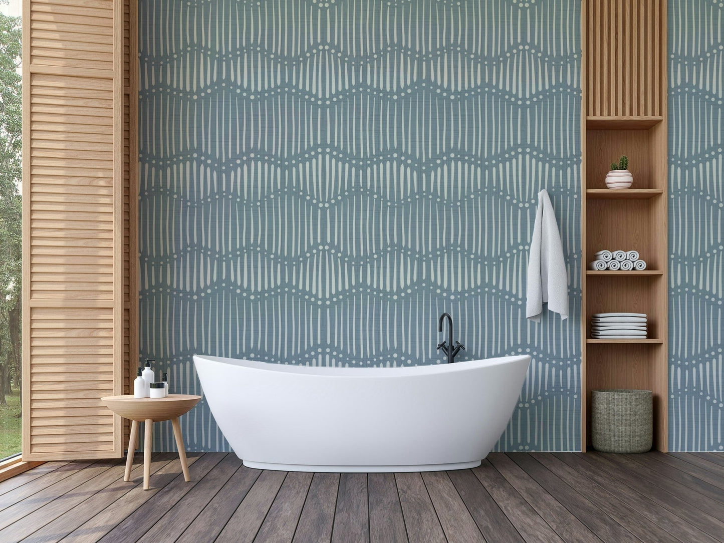 Boho Waves On Arona Canvas wallpaper in blue-grey behind a white freestanding tub with wood slat shelving