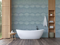 Boho Waves On Arona Canvas wallpaper in blue-grey behind a white freestanding tub with wood slat shelving