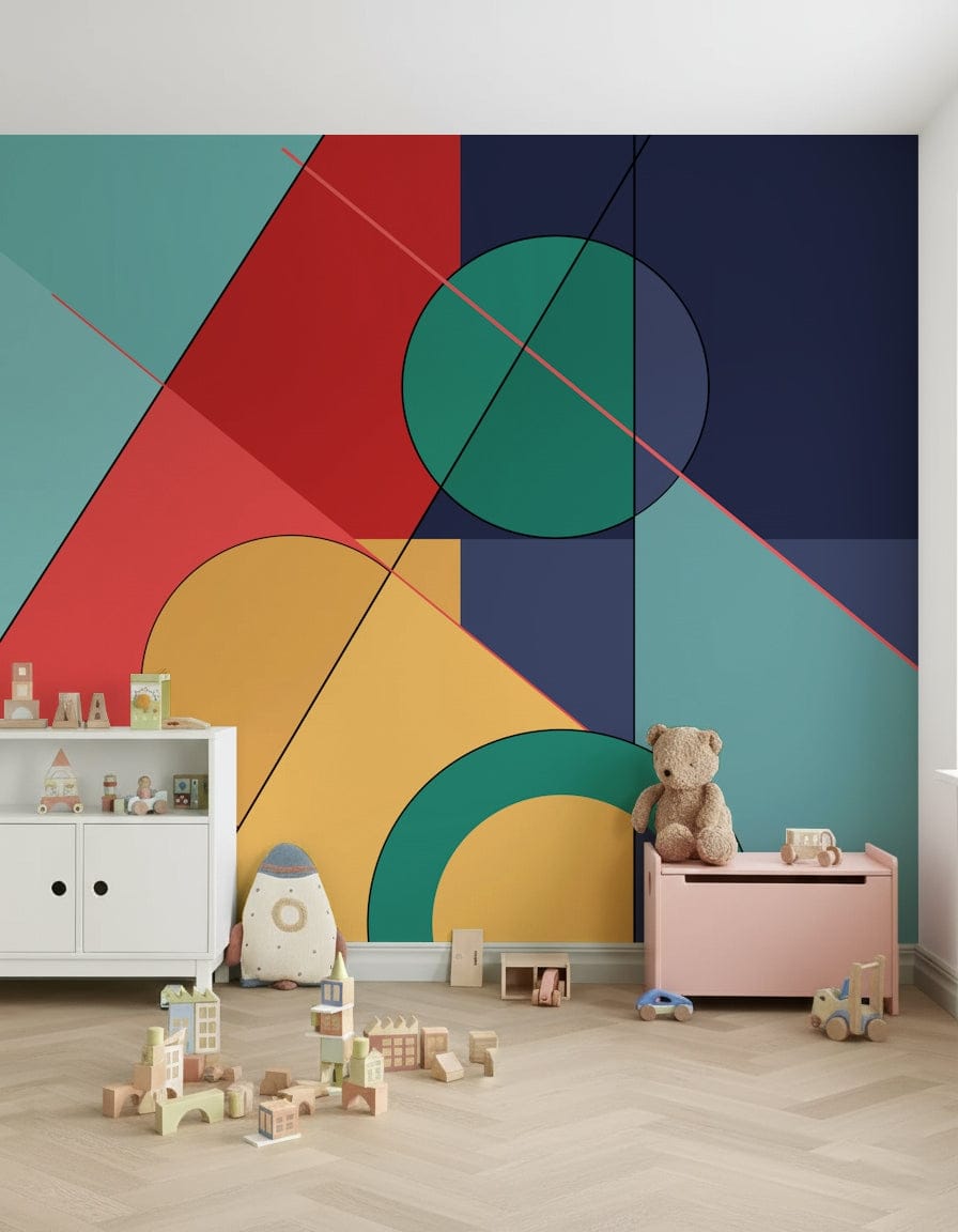 Bold Bauhaus wallpaper mural of bright geometric shapes in a kids room with a teddy bear and wood blocks
