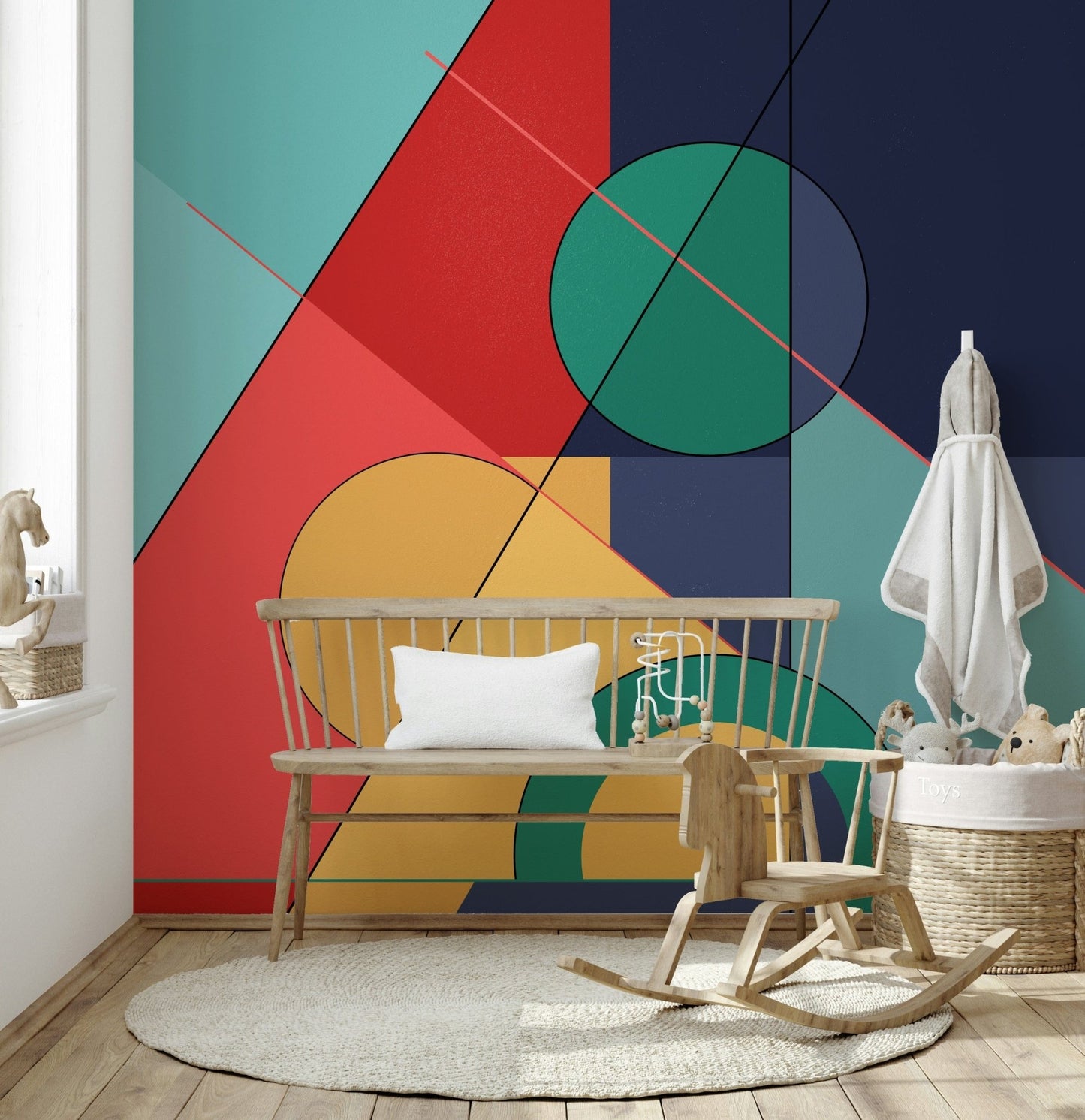 Bold Bauhaus wallpaper mural of bold shapes in a nursery with a wood bench and rocking horse