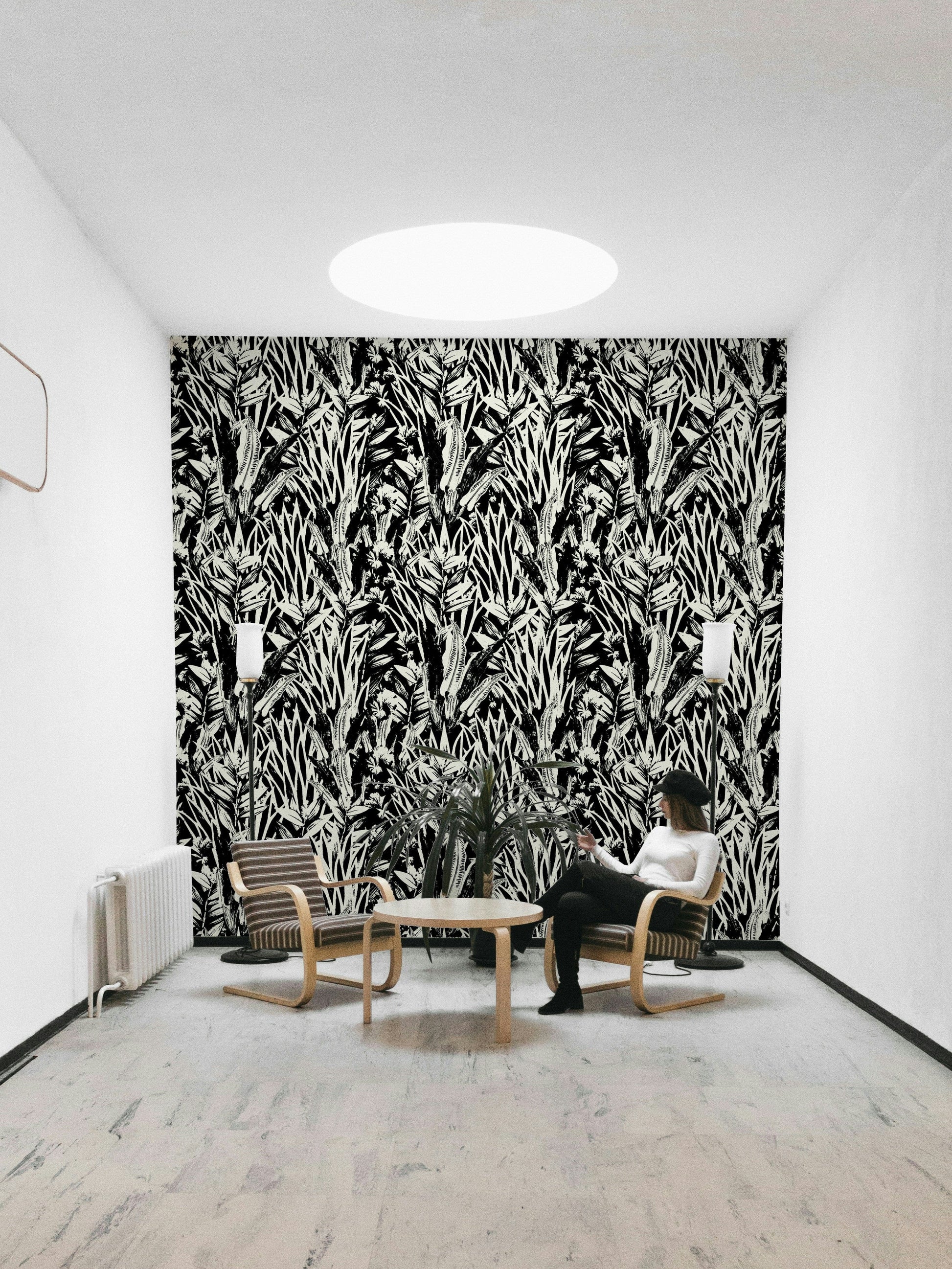 A full-wall mural showing a botanical pattern.
