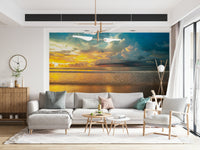 Lush coastal clouds and warm sunset tones illuminating the sea in a soothing Borneo Beach wallpaper.