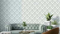 Sage green botanical wallpaper with leafy design

