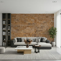 Brickwork Beauty wallpaper mural in orange stone behind a gray sectional sofa in a modern living room