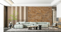 Brickwork Beauty wallpaper mural in rust stone beside wood slats behind a mint green sectional sofa