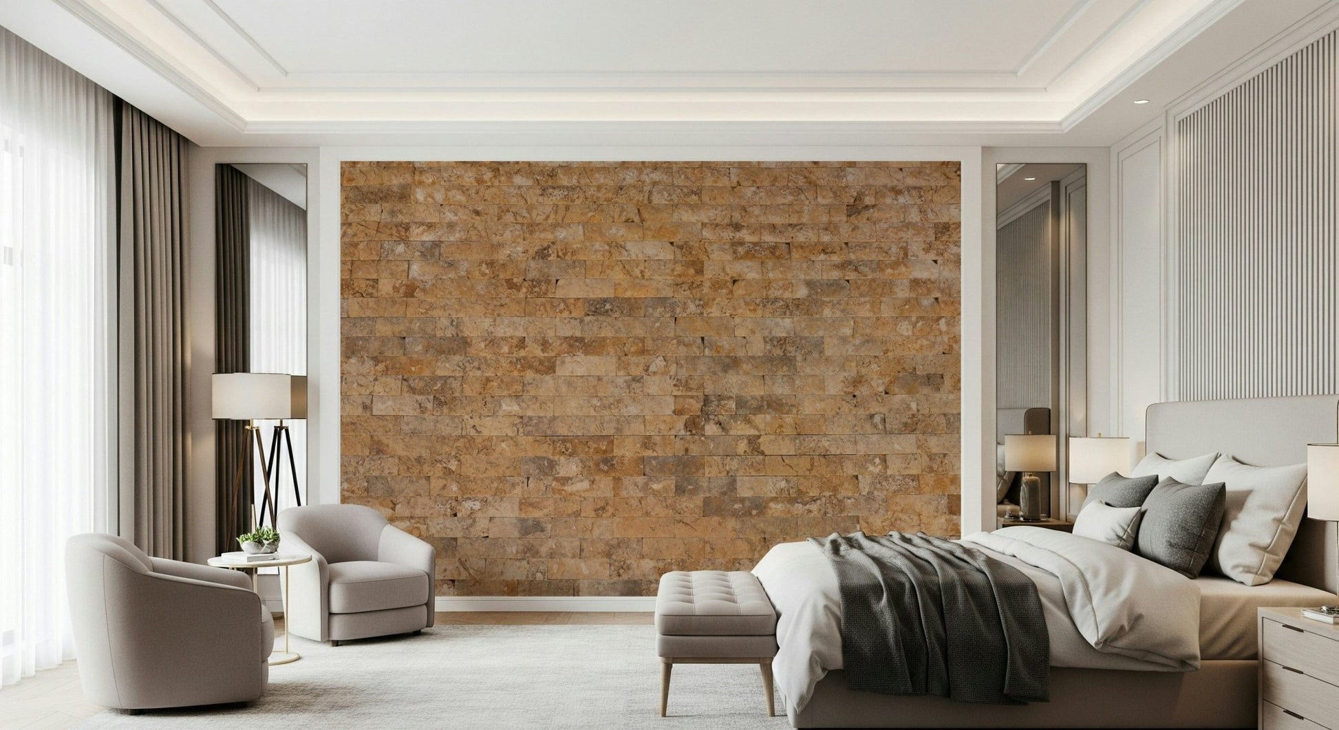Brickwork Beauty wallpaper mural in golden stone behind a beige bed and pair of armchairs in a luxe bedroom