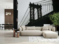 Wall mural with a silhouetted urban bridge and softly glowing city backdrop.