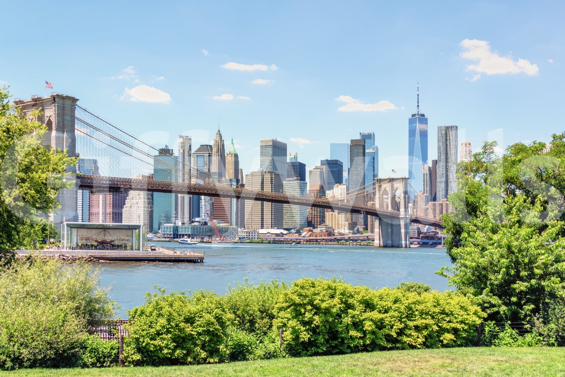 Bridge to Manhattan wall mural shown full-wall: the Brooklyn Bridge spanning blue water before the Manhattan skyline