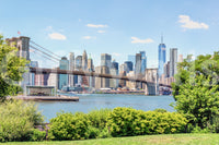 Bridge to Manhattan wall mural shown full-wall: the Brooklyn Bridge spanning blue water before the Manhattan skyline