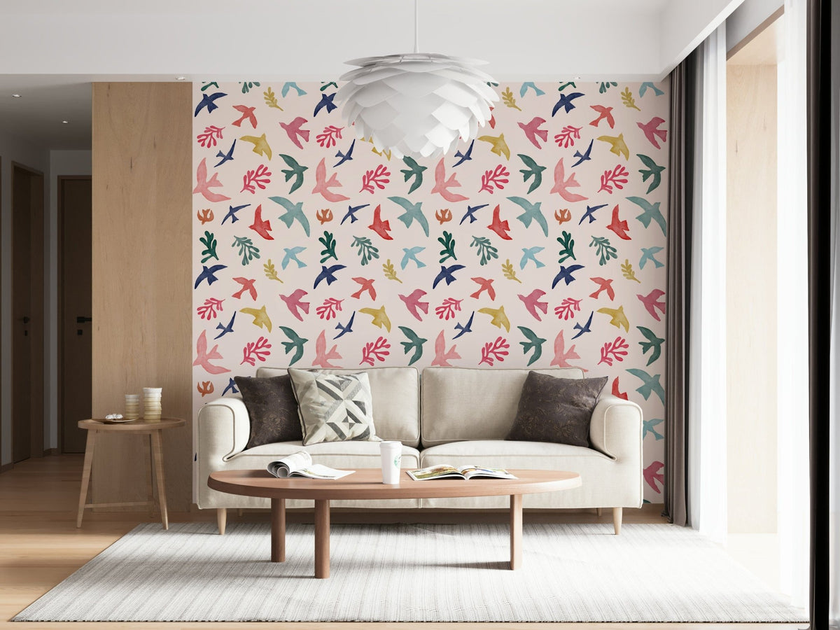 Bright Freedom Birds wallpaper behind a cream sofa with an oval wood coffee table in a living room