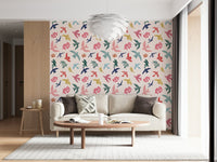 Bright Freedom Birds wallpaper behind a cream sofa with an oval wood coffee table in a living room
