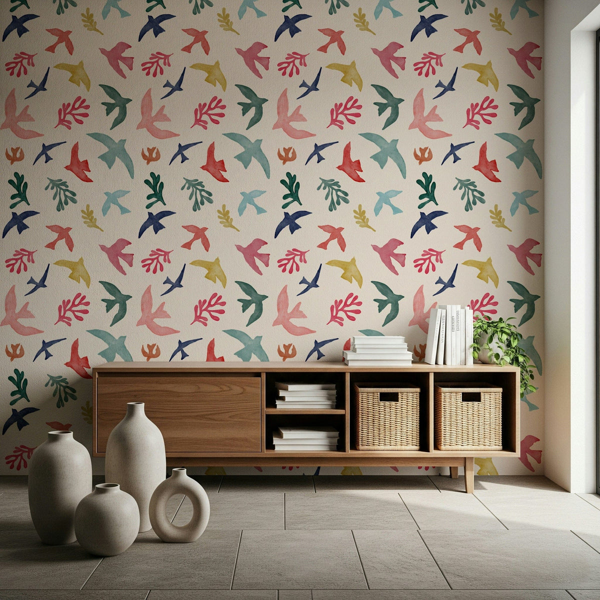 Bright Freedom Birds wallpaper above a wood console with baskets and floor vases in a living room