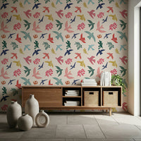 Bright Freedom Birds wallpaper above a wood console with baskets and floor vases in a living room