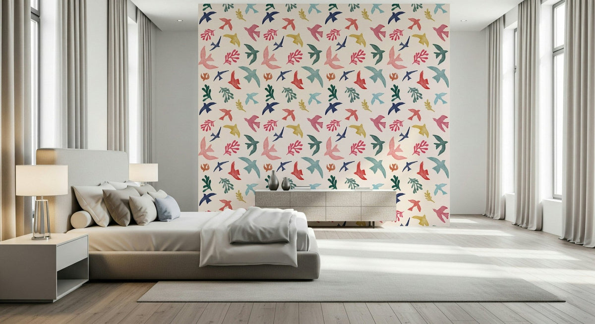 Bright Freedom Birds wallpaper behind a grey bed with table lamps in a bright bedroom