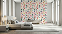 Bright Freedom Birds wallpaper behind a grey bed with table lamps in a bright bedroom
