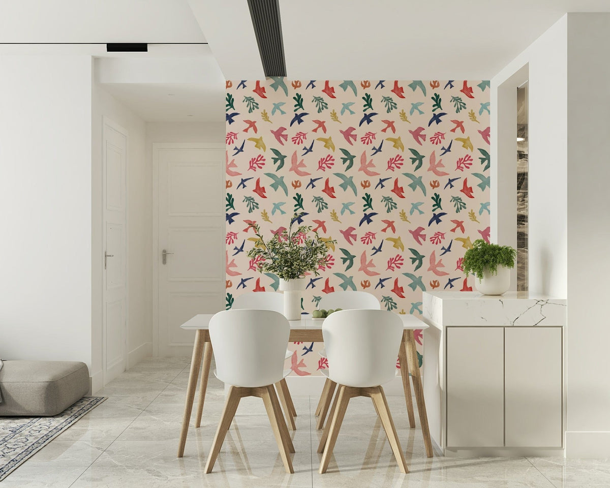 Bright Freedom Birds wallpaper behind a white dining table and chairs near a marble counter