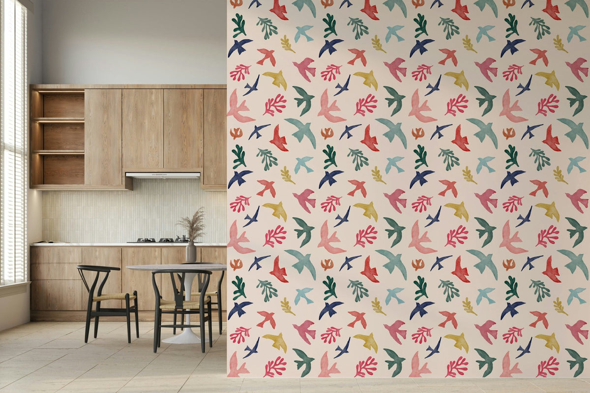 Bright Freedom Birds wallpaper beside wood cabinets and a round dining table in a kitchen
