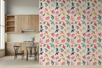 Bright Freedom Birds wallpaper beside wood cabinets and a round dining table in a kitchen