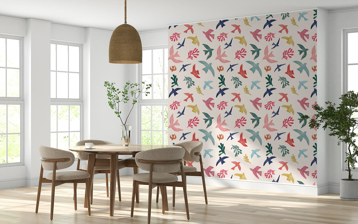Bright Freedom Birds wallpaper behind a round wood dining table and rattan pendant light