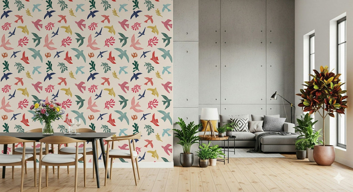 Bright Freedom Birds wallpaper behind a dark dining table beside a grey sectional and concrete wall