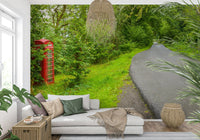 UK phone booth wallpaper for walls, surrounded by lush, vibrant greenery. Call Box Charm.