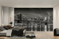 Calm water reflections under illuminated bridge mural wallpaper

