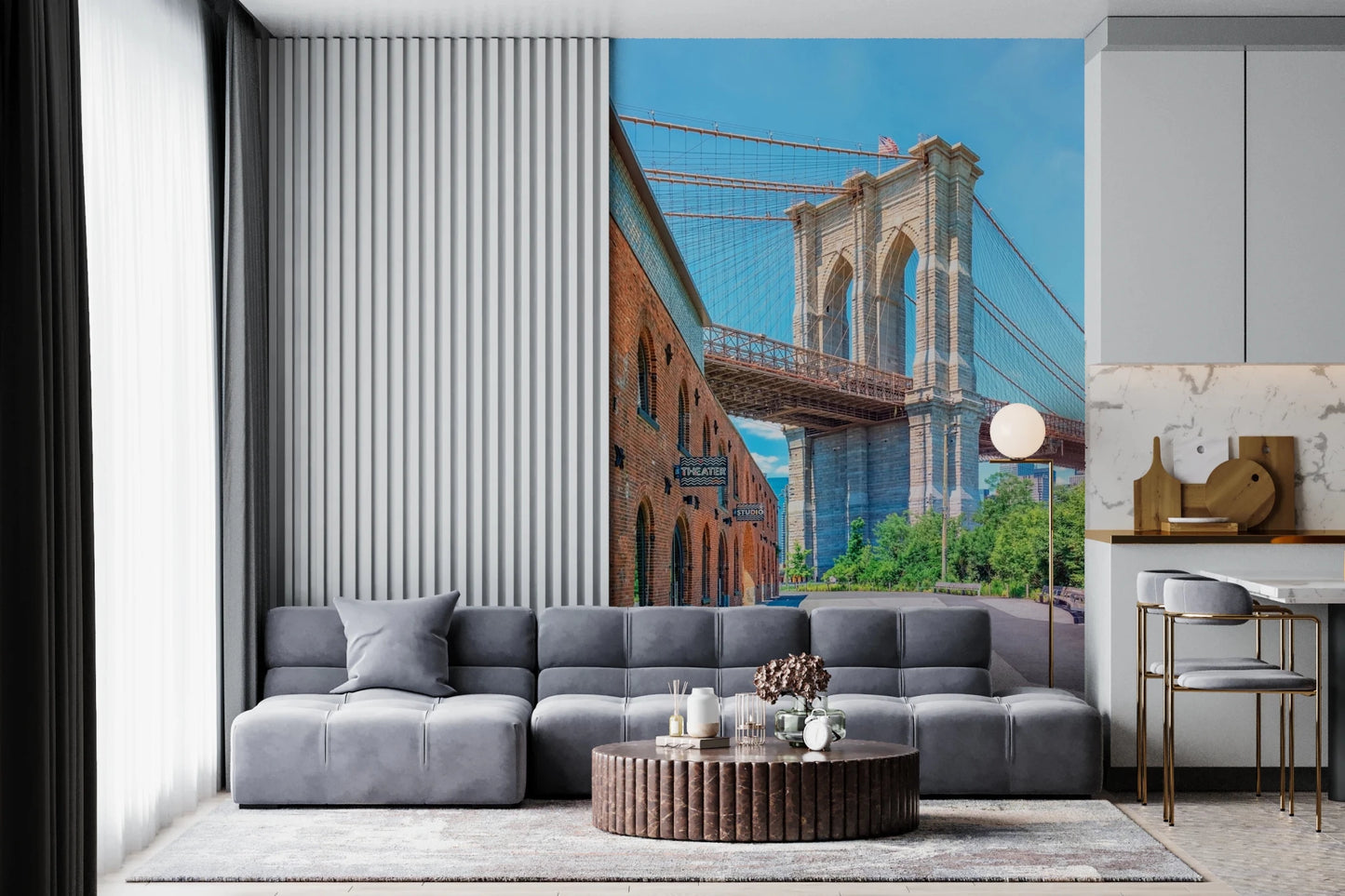 Brooklyn Bridge Vista wallpaper mural of the stone bridge tower and brick warehouse behind a grey sectional in a living room
