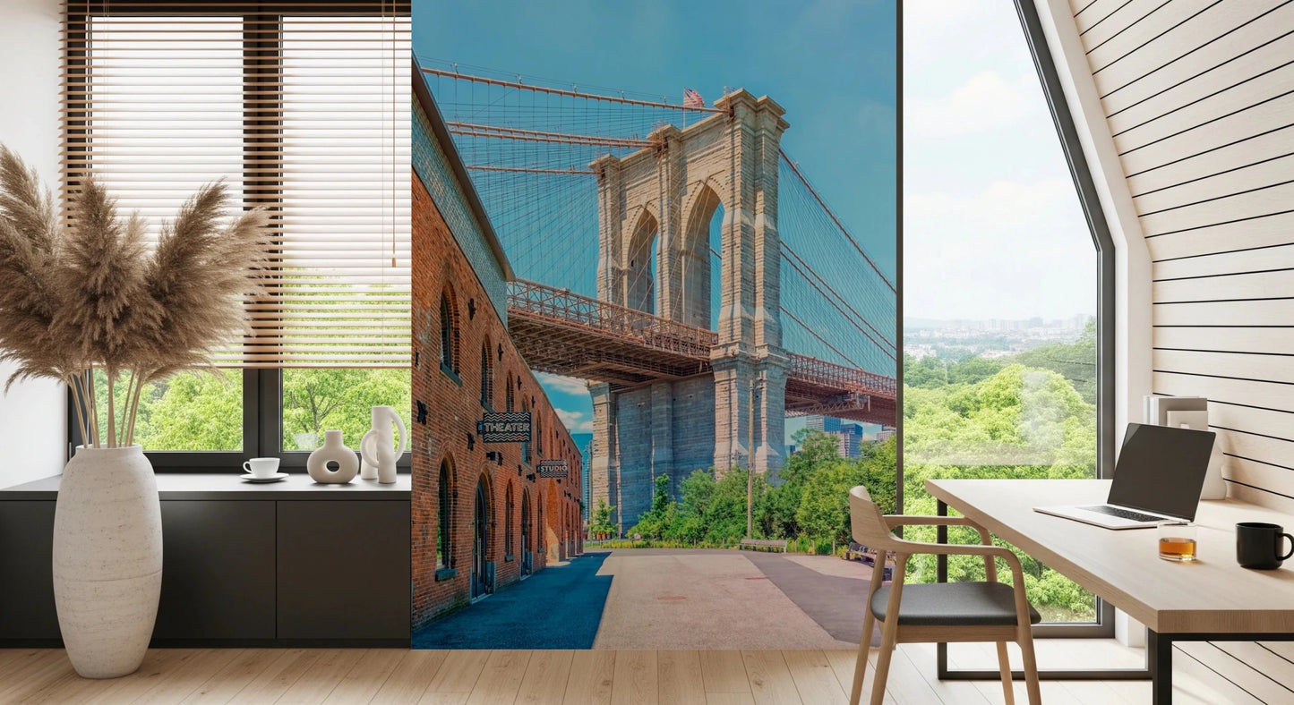 Brooklyn Bridge Vista wallpaper mural of the bridge behind a wood desk and cane chair in a home office by a garden window