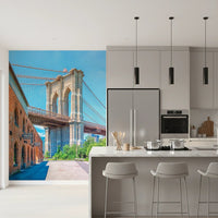 Brooklyn Bridge Vista wallpaper mural with the bridge arches beside a marble kitchen island with grey bar stools