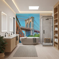 Brooklyn Bridge Vista wallpaper mural of the bridge tower beside a freestanding tub and wood vanity in a bathroom