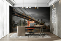 Dramatic bridge mural featuring lit-up New York skyline

