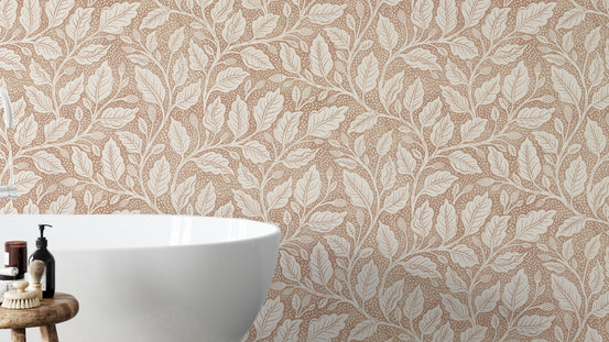 Brown Budding Branches wallpaper with cream leafy vines on tan in a bathroom beside a white freestanding tub