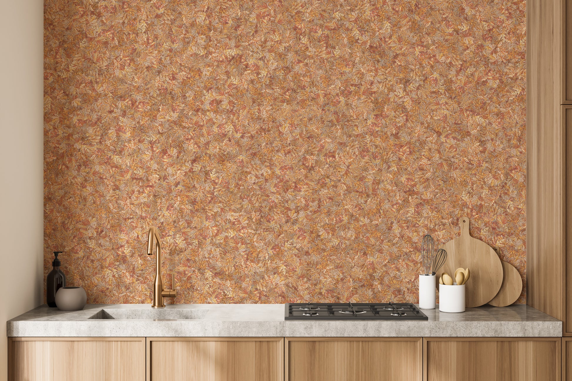 Brown Color Autumn Leaves wallpaper mural in warm orange behind a wood kitchen counter with a gold faucet