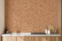 Brown Color Autumn Leaves wallpaper mural in warm orange behind a wood kitchen counter with a gold faucet