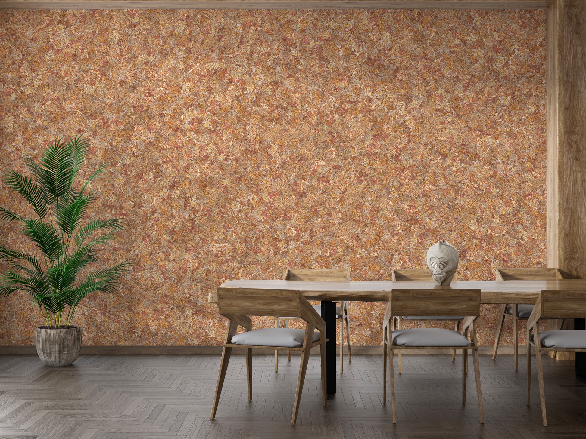 Brown Color Autumn Leaves wallpaper mural in orange behind a wooden dining table and chairs with a potted palm