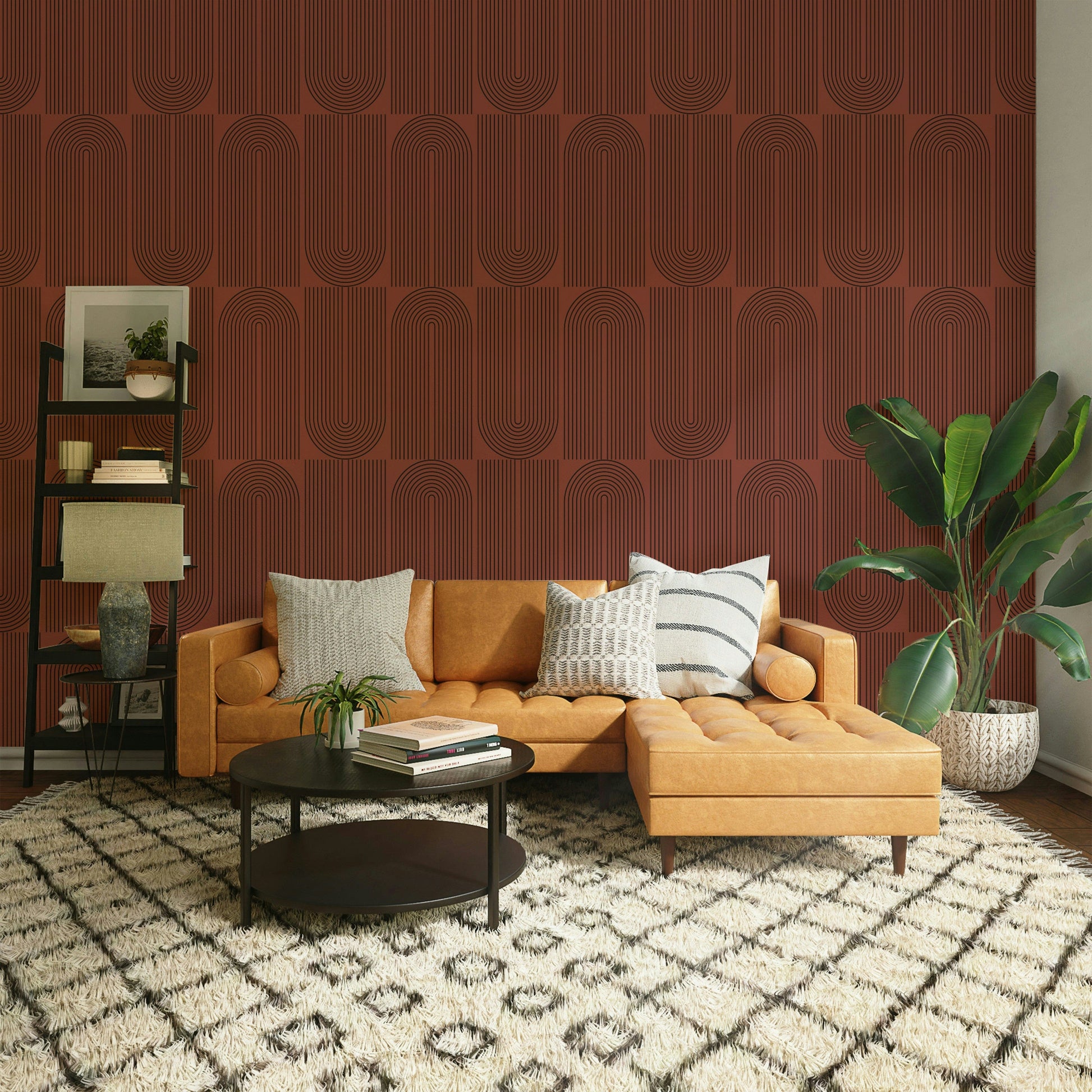 A bedroom decorated with a geometric wallpaper

