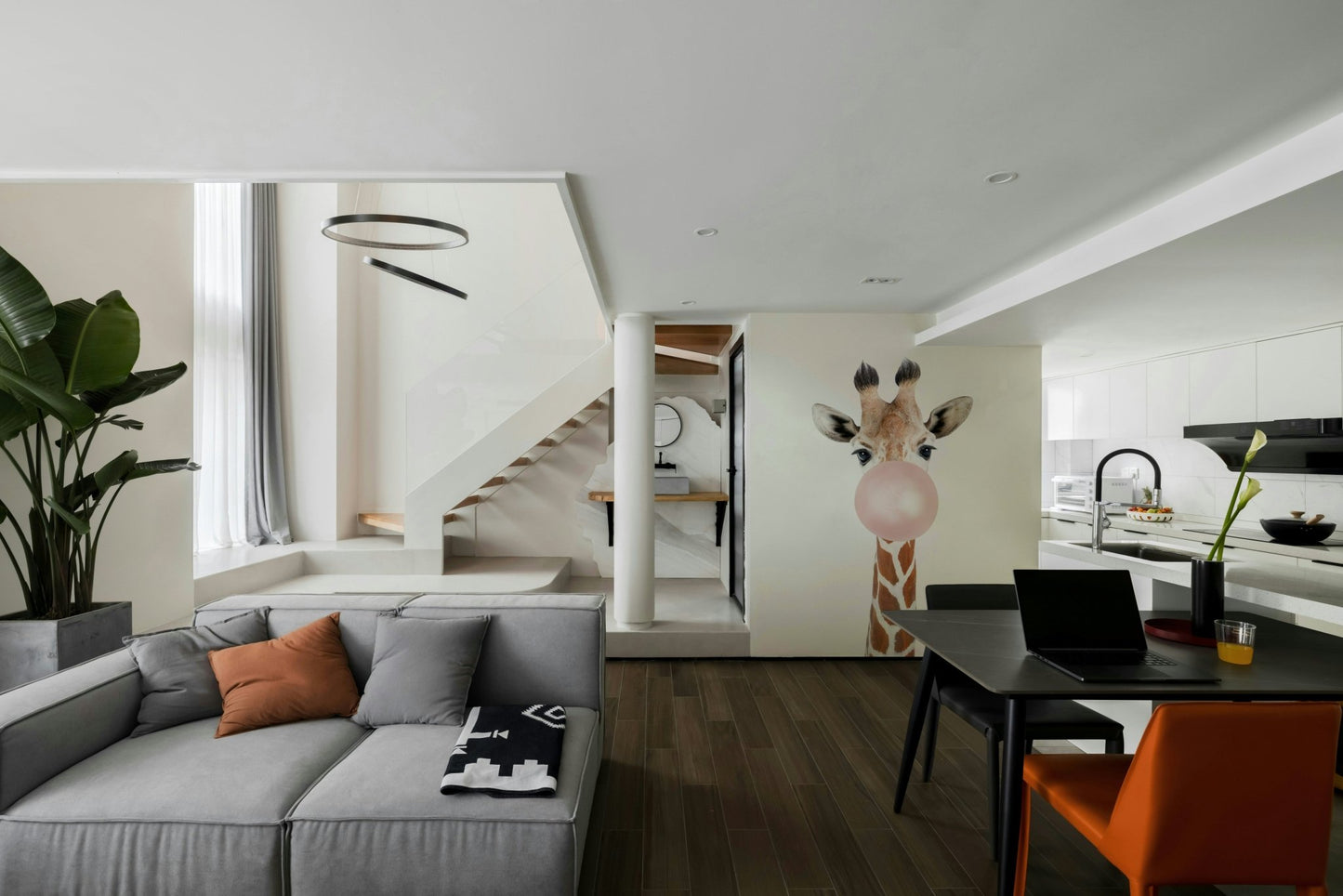 Bright and playful giraffe wall mural with bubble gum.

