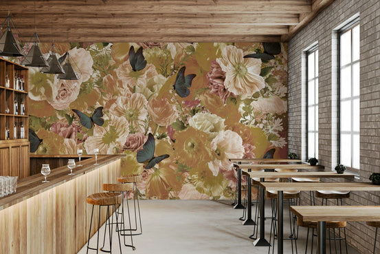 Butterfly Garden Bloom wallpaper mural of vintage roses and blue butterflies along a wood bar counter and stools in a cafe
