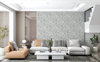 Butterfly Bloom Line Art wallpaper behind a grey sectional and tan leather chaise near a staircase