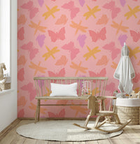 Patterned insect wallpaper featuring stylized winged creatures in gentle, warm pastel hues.